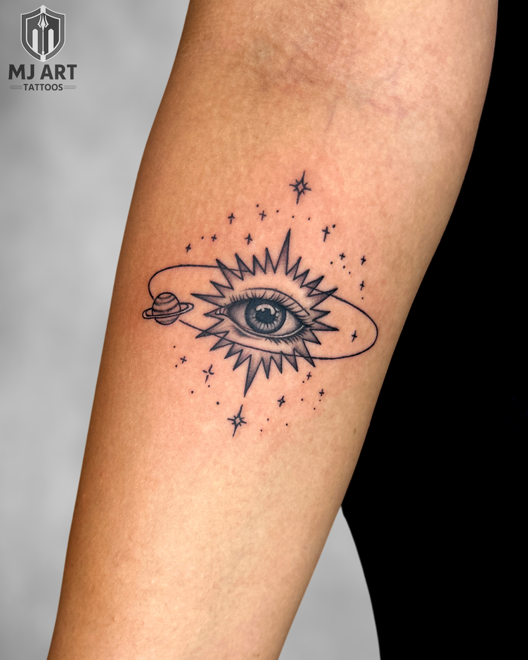 Cosmic Eye Jupiter Universe Forearm Tattoo