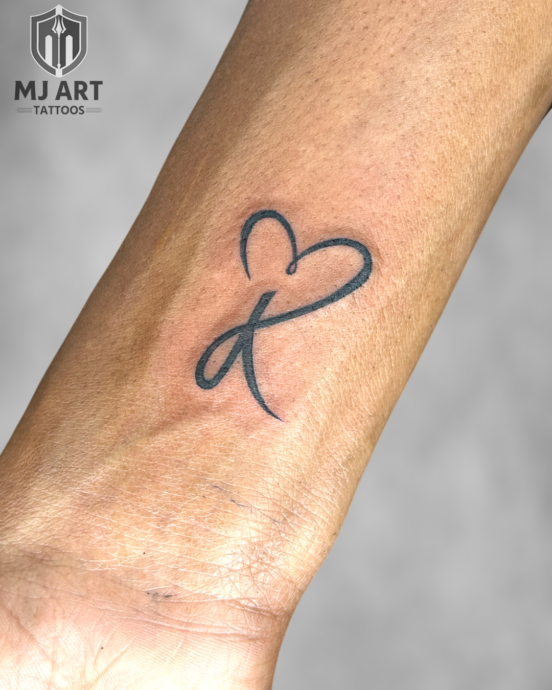 Infinity Heart Loop Fine Line Tattoo