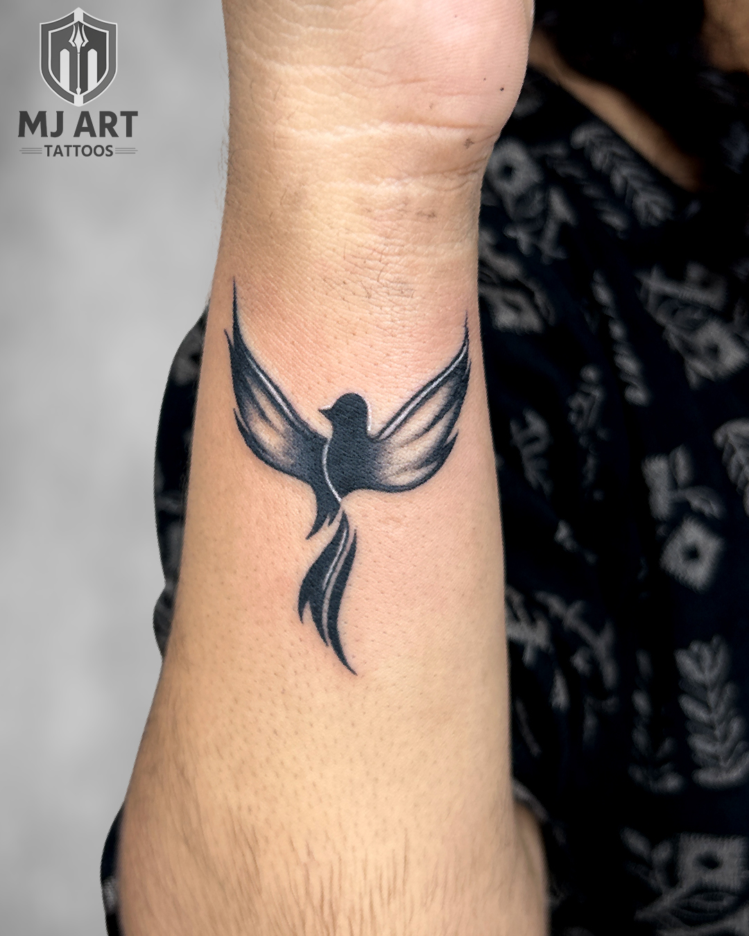 Bird Silhouette Fine Line Wrist Tattoo