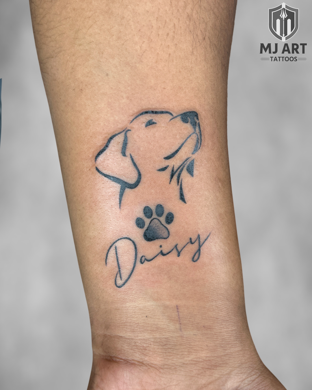 Daisy Dog Paw Wrist Tattoo