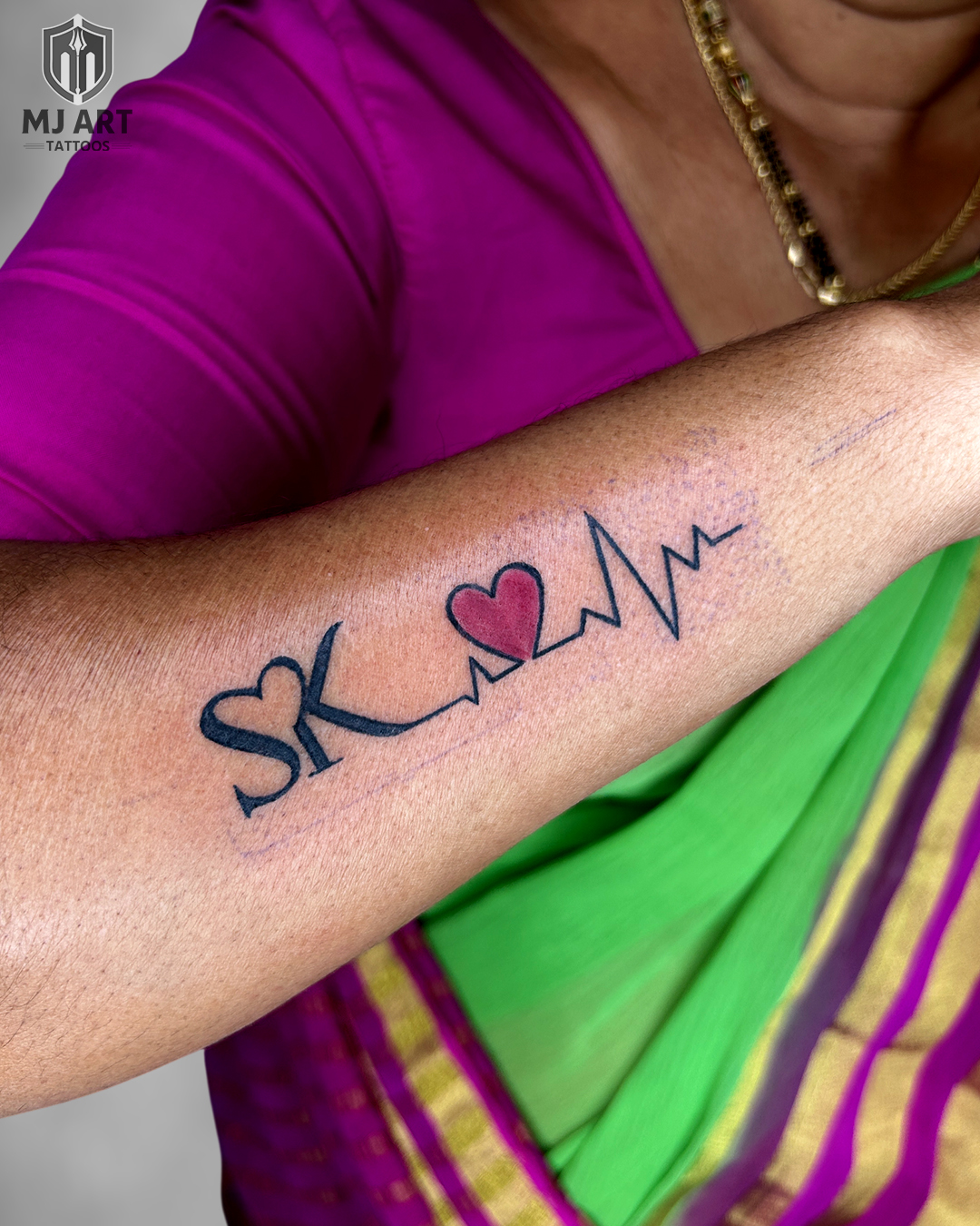 SK Initials Heartbeat Forearm Tattoo