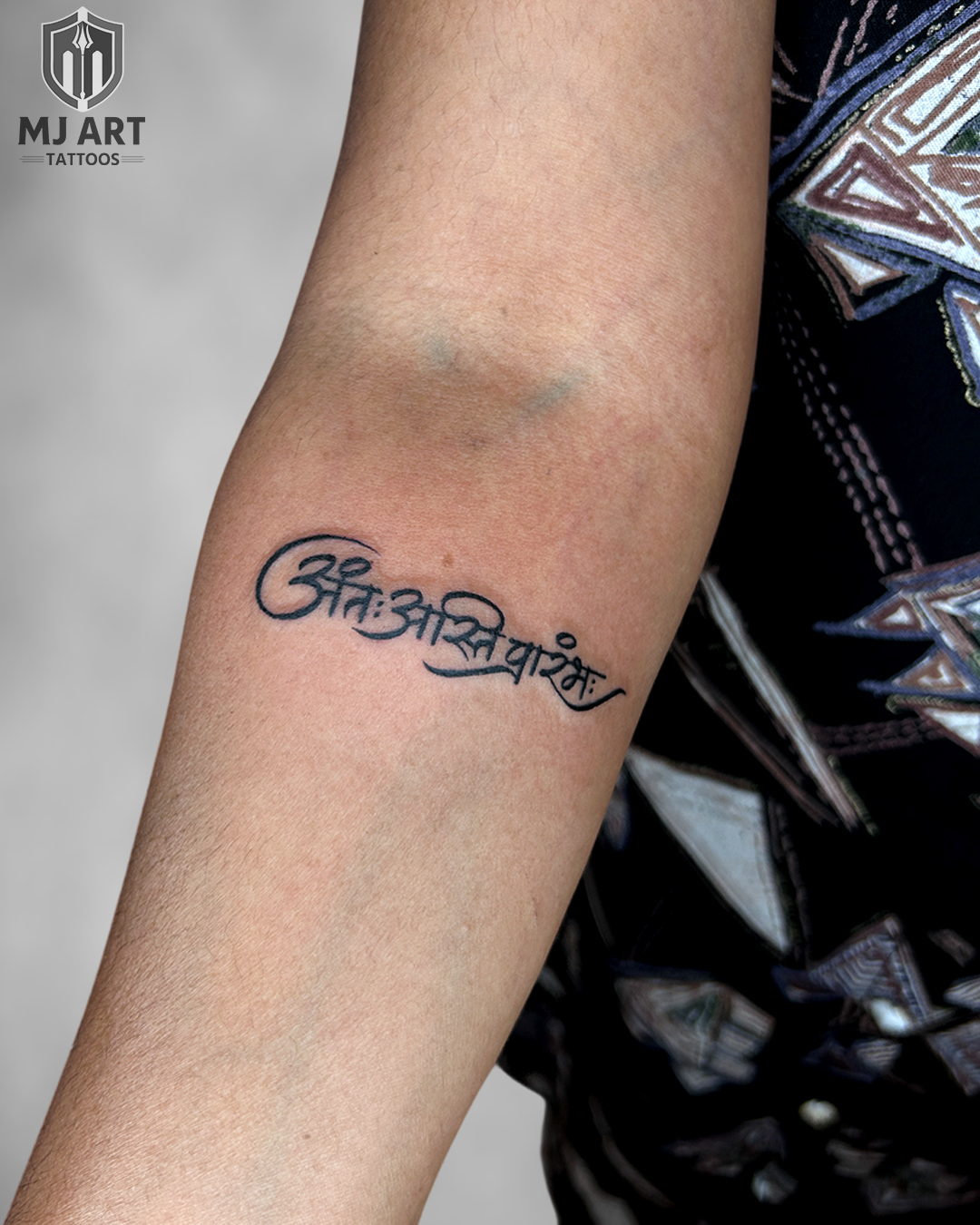 Sanskrit Mantra Script Forearm Tattoo