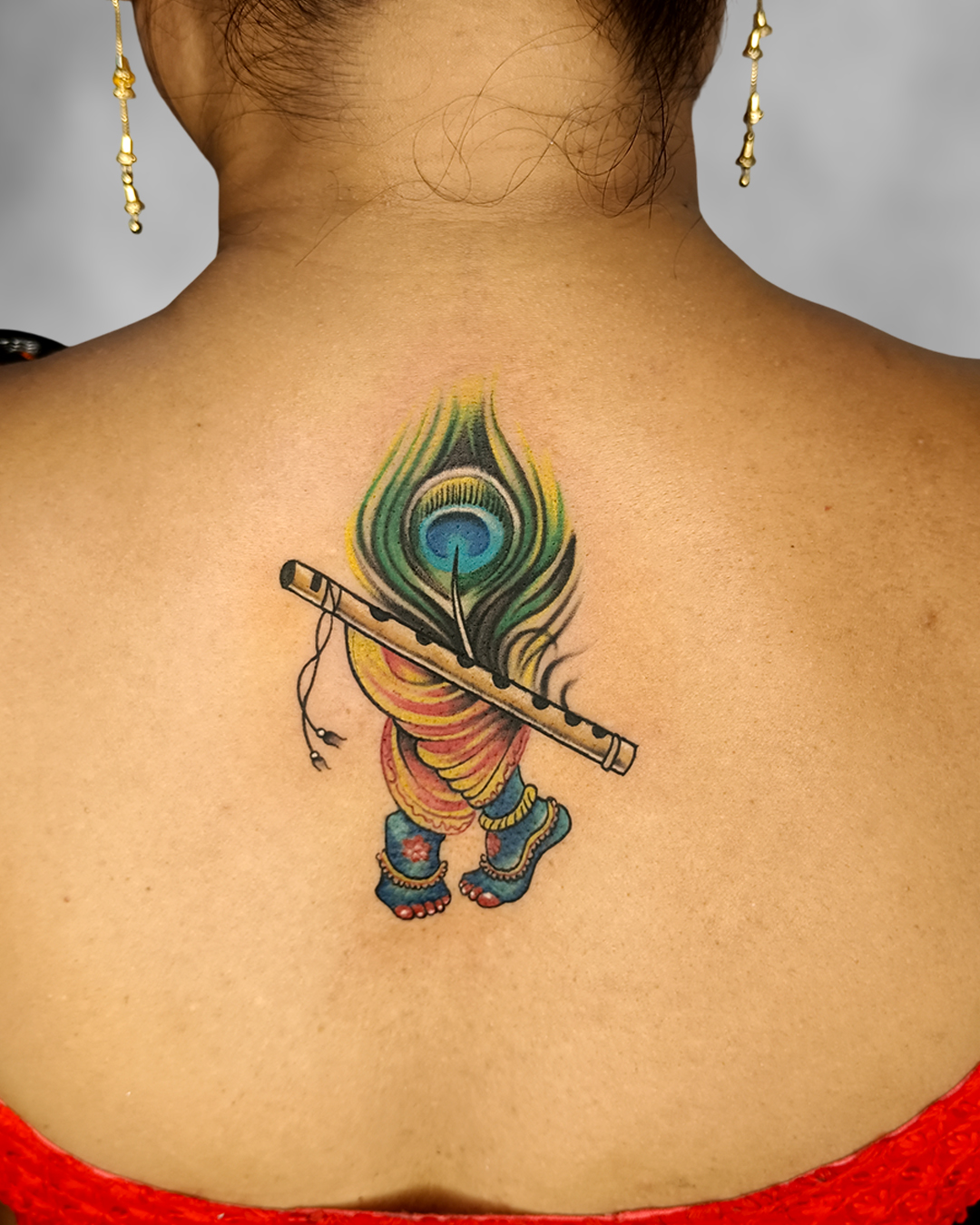 Krishna Flute Peacock Feather Back Tattoo