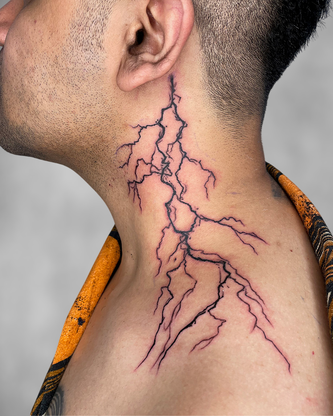 Lightning Bolt Neck Tattoo