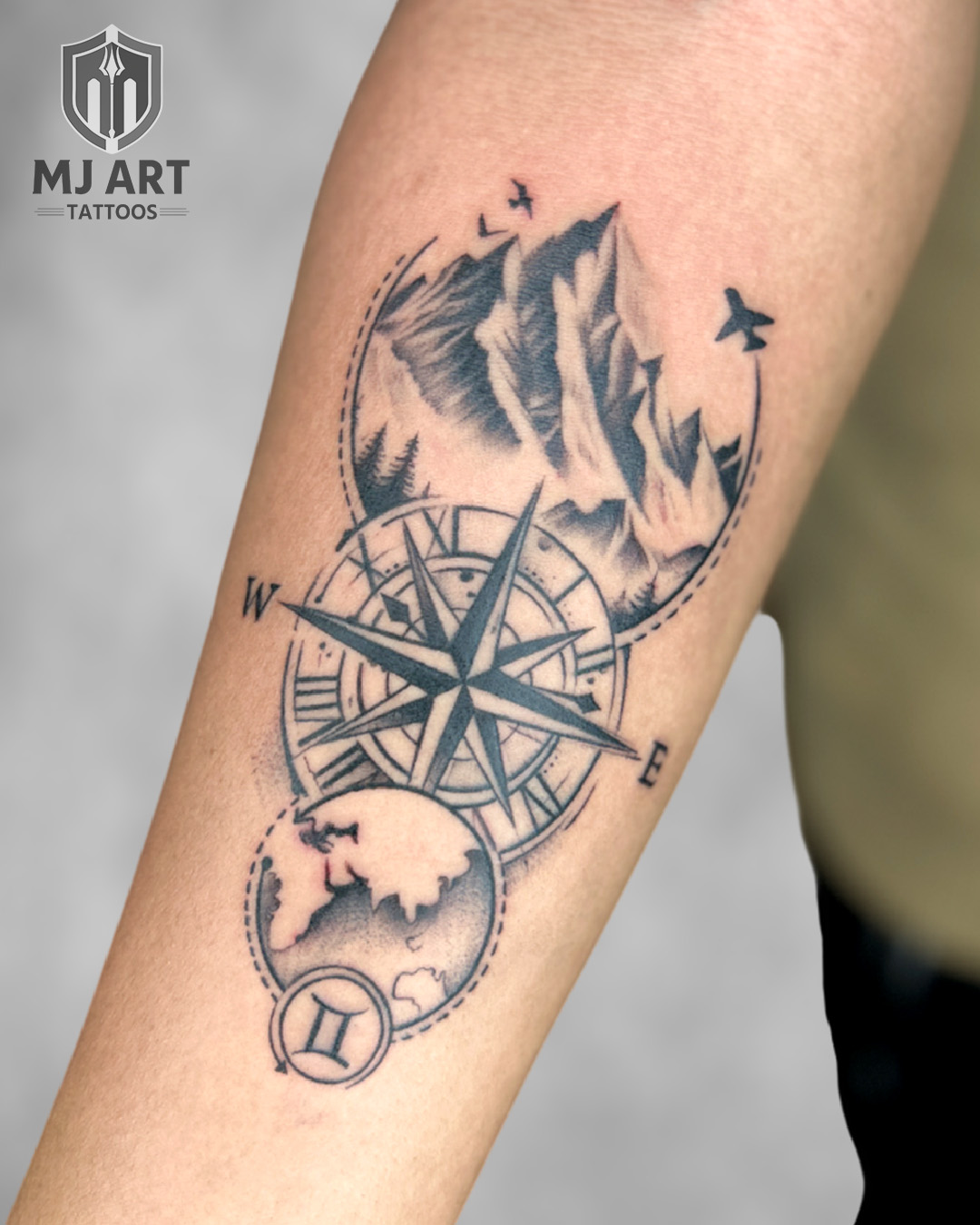 Compass Mountain Travel Forearm Tattoo