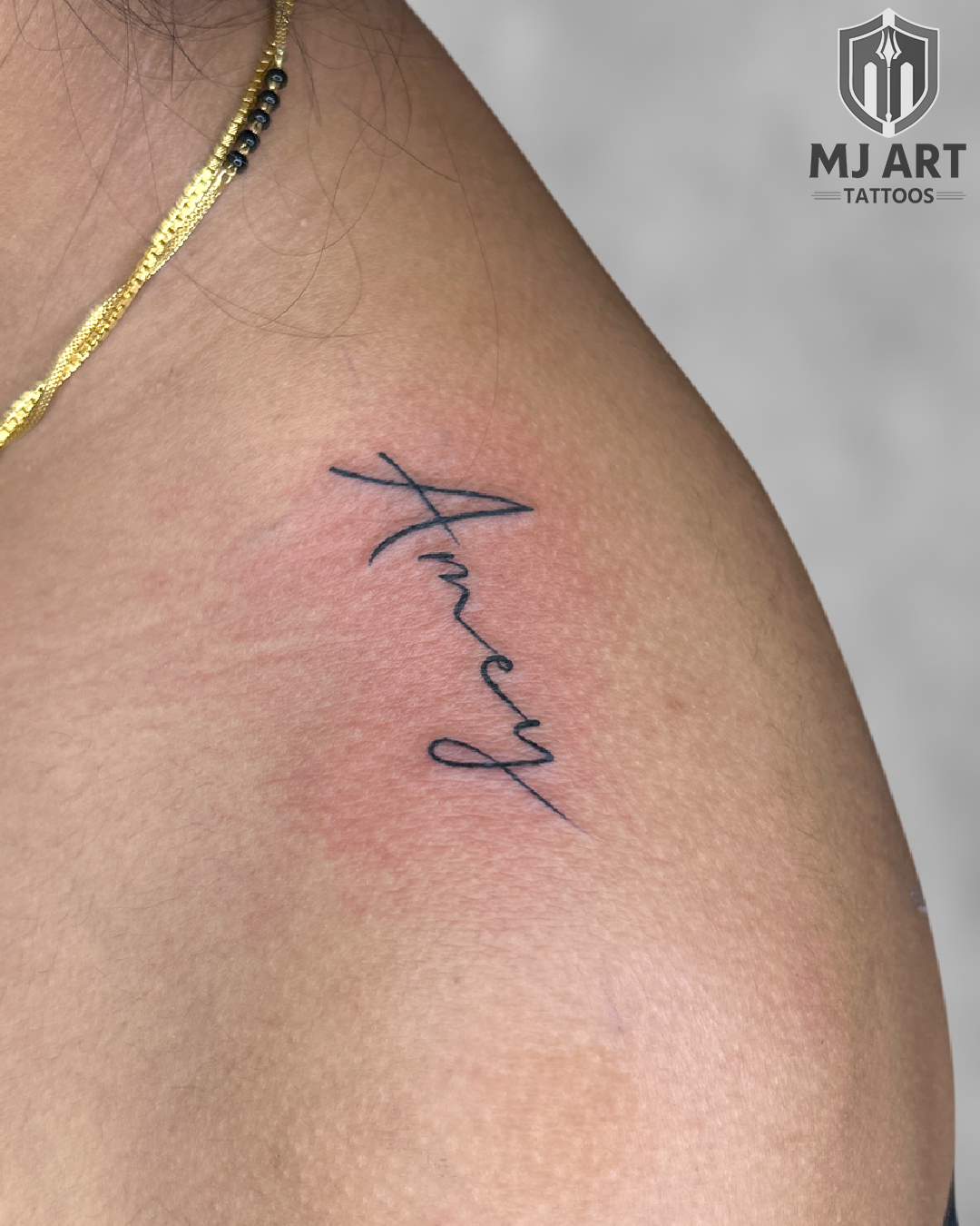 Anucy Fine Line Name Tattoo