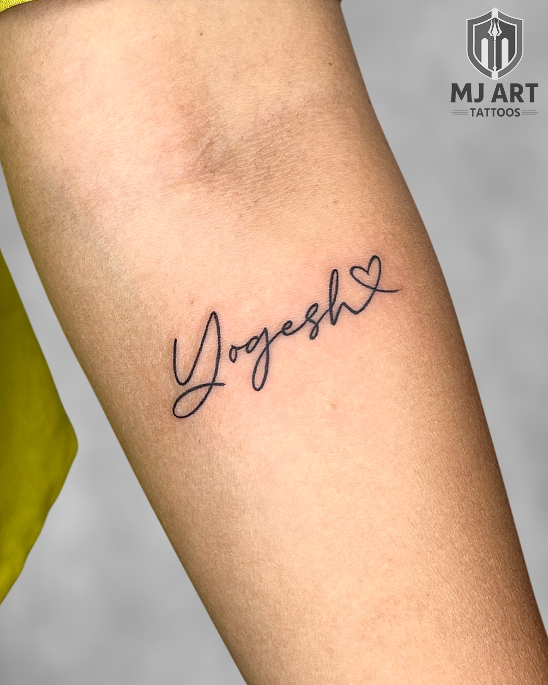 Yogesh Name Script Tattoo