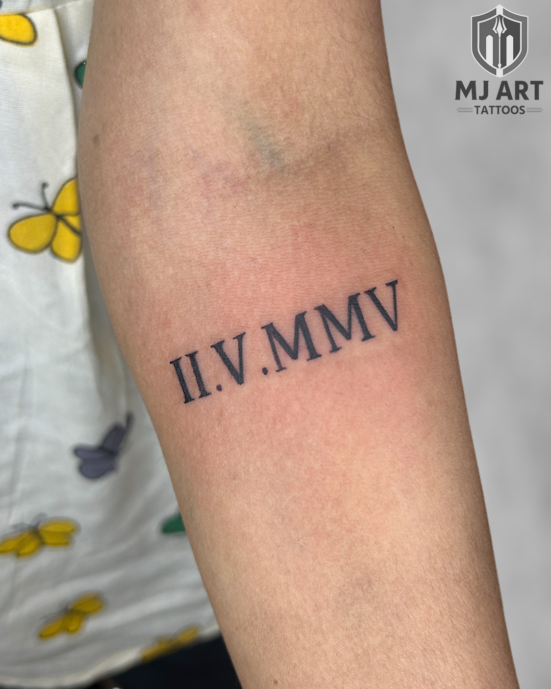 Roman Numerals II.V.MMV Tattoo